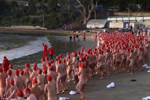 Red caps at the Nude Solstice swim