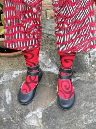Black strap shoes with handpainted red stockings
